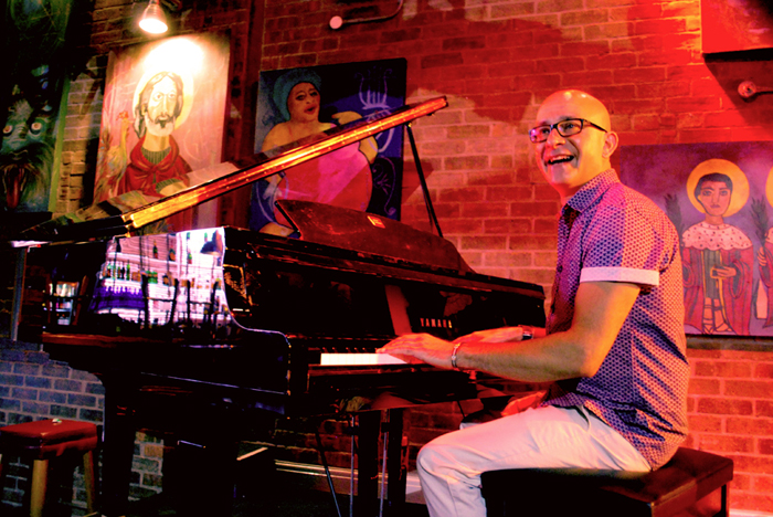 Dino Baptiste live on stage with piano